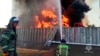 Vatrogasci rade na gašenju požara u rezervoaru nafte u Rostovskoj oblasti u Rusiji, na fotografiji napravljenoj od video snimka koji je objavila pres-služba Ministarstva za vanredne situacije Rusije, 18. juna 2024.