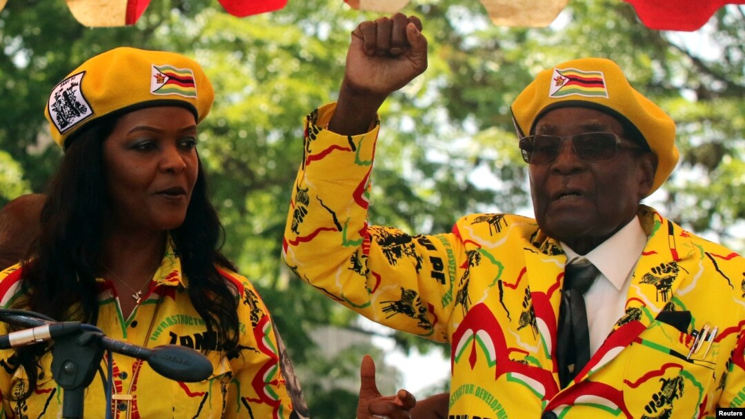 President Robert Mugabe and his wife, Grace, attend a rally of his ruling ZANU-PF party in Harare, Zimbabwe, Nov. 8, 2017. 