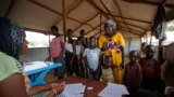 FILE - A South Sudanese refugee family are registered at a refugee transit center in Kuluba, northern Uganda, June 8, 2017. 