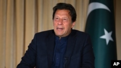 FILE - In this March 16, 2020, photo, Pakistan's Prime Minister Imran Khan gives an interview to The Associated Press, in Islamabad, Pakistan.