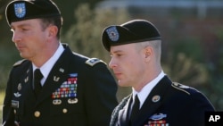 FILE - Army Sgt. Bowe Bergdahl, right, arrives for a pretrial hearing at Fort Bragg, N.C., with his defense counsel, Lt. Col. Franklin D. Rosenblatt, Jan. 12, 2016.