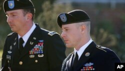 FILE - Army Sgt. Bowe Bergdahl, right, arrives for a pretrial hearing at Fort Bragg, N.C., with his defense counsel Lt. Col. Franklin D. Rosenblatt.