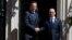 Britain's Prime Minister David Cameron greets the President of Burma Thein Sein in Downing Street, central London, July 15, 2013. 