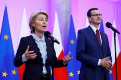 FILE - Incoming head of the European Commission Ursula von der Leyen speaks during a meeting with Polish Prime Minister Mateusz Morawiecki at the Prime Minister Chancellery in Warsaw, Poland, July 25, 2019.