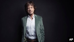 FILE - Mick Jagger of the Rolling Stones poses for a portrait in New York, Nov. 14, 2016. 