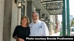 Brenda Prudhomme, and her husband, executive chef Paul Miller outside of their restaurant K-Paul's Louisiana Kitchen. (Photo courtesy Brenda Prudhomme)