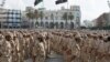 FILE - Military units under the Tripoli government stand in formation during a celebration of the 75th anniversary of the establishment of the Libyan Army in Martyrs Square, Tripoli, Aug. 13, 2015.