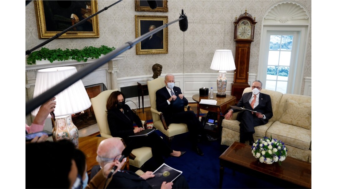 President Joe Biden and Vice President Kamala Harris meet with Senate Majority Leader Chuck Schumer (D-NY) and Democratic senators to discuss efforts to pass coronavirus relief legislation in the Oval Office at the White House, Feb. 3, 2021.