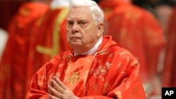 FILE - In this Tuesday, March 12, 2013 file photo, Cardinal Bernard Law attends a Mass for the election of a new pope celebrated by Cardinal Angelo Sodano, not pictured, inside St. Peter's Basilica, at the Vatican. 