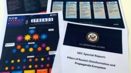 FILE - Pages related to Russia's disinformation campaign are seen in the U.S. State Department's Global Engagement Center report released Aug. 5, 2020.