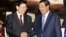 Cambodia's Prime Minister Hun Sen, right, shakes hands with his Laos Prime Minister Thongloun Sisoulith as they meet at Peace Palace, in Phnom Penh, Cambodia, Monday, June 27, 2016. Thongloun is on an official visit to Cambodia to further expand and strengthen the existing traditional relations of friendship, good neighborliness, and comprehensive cooperation between the two countries, according to a release. (AP Photo/Heng Sinith)
