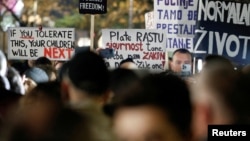 Protesters hold placards during a rally in front of the Interior Ministry building demanding resignations after the Cetinje shooting rampage, in Podgorica, Montenegro, Jan. 5, 2025.