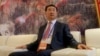 Wang Jianlin, chairman of Chinese property developer Dalian Wanda Group, sits in a meeting room as he arrives for the launch ceremony for the Qingdao Oriental Movie Metropolis on the outskirts of Qingdao September 22, 2013.