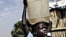 A Sudanese boy carries water home for his family.