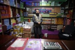 In this Dec. 14, 2019, photo, jailed Taliban shopkeeper poses for photograph inside the Pul-e-Charkhi jail in Kabul, Afghanistan.