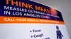 A poster released by Los Angeles County Department of Public Health is seen as experts answer questions regarding the measles response and the quarantine orders in Los Angeles, April 26, 2019. 