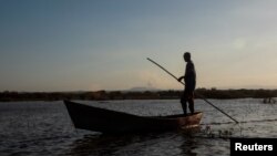 A fisherman stands on his boat as he fishes at the Tisma lagoon wetland park, also designated as Ramsar Site 1141 in the Convention on Wetlands, in Tisma, Nicaragua, April 18, 2018.