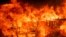 Flames consume a home as the River Fire tears though Lakeport, Calif., July 31, 2018.