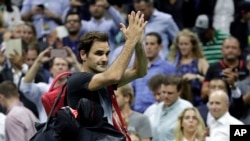 Roger Federer, of Switzerland, acknowledges spectators while leaving the court after losing to Juan Martin del Potro, of Argentina, during the quarterfinals of the U.S. Open tennis tournament, Wednesday, Sept. 6, 2017, in New York. (AP Photo/Julio Cortez)