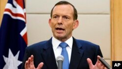 FILE - In this April 12, 2014, Australian Prime Minister Tony Abbott speaks during a press conference at a hotel in Beijing, China. 