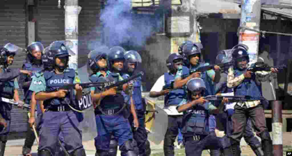 Bangladeshi policemen disperse protesters in Rajshahi, Bangladesh, Friday, March 1, 2013. Protesters clashed with police for a second day Friday as the death toll rose to at least 44 in clashes triggered by a death sentence given to Delwar Hossain Sayedee