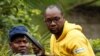 FILE - Activist Pastor Evan Mawarire is taken into a vehicle by police outside his home in Harare, Zimbabwe, Jan. 16, 2019.