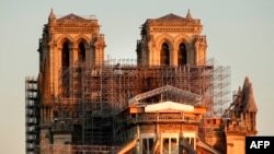 Paris' Cathedral Notre Dame at the sunrise on the eve of the first anniversary of the violent fire who destroyed a large part of the monument, April 14, 2020.