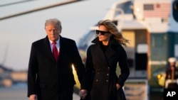 President Donald Trump and first lady Melania Trump board Air Force One at Andrews Air Force Base, Md., Dec. 23, 2020. Trump raveled to his Mar-a-Lago resort in Palm Beach, Florida. 