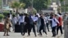 Students throw stones at police during clashes as they protest over an alleged on-campus rape in Punjab, in Rawalpindi, Pakistan, Oct. 17, 2024.