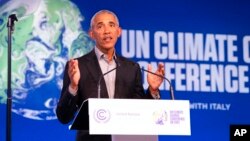 Former U.S. President Barack Obama gestures as he speaks during the COP26 U.N. Climate Summit in Glasgow, Scotland, Nov. 8, 2021.