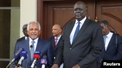 FILE- Dafallah Al-Haj Ali, special envoy for Sudan's Army Chief Abdel Fattah al-Burhan, attends a press conference with South Sudan's Foreign Minister Deng Dau Deng, (front left) after a meeting in Juba, South Sudan May 8, 2023.