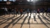 FILE - Children practice the sport of fencing, on the outskirts of Kigali, Rwanda, April 4, 2024. 