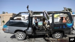 Afghan journalists film the site of a bomb explosion in Kabul, Afghanistan, June 3, 2021. 