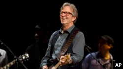 Eric Clapton performs at Eric Clapton's Crossroads Guitar Festival 2013 at Madison Square Garden on Sunday April 14, 2013 in New York. (Photo by Charles Sykes/Invision/AP)