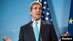 U.S. Secretary of State John Kerry makes a statement at a joint news conference with Germany's foreign minister (not pictured) at Berlin Tegel Airport, Jan. 31, 2014. 