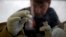 FILE - A scientist separates blood from plasma cells to isolate any Ebola RNA to test for the virus at the European Mobile Laboratory in Gueckedou, Guinea.
