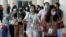 Passengers wearing medical masks are pictured at the international arrival terminal of I Gusti Ngurah Rai airport following an outbreak of the new coronavirus in China, in Bali, Indonesia, Feb. 4, 2020.