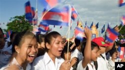 Cambodia students hold the Cambodian national flags as they attend the Independence Day celebration at the Independence Monument in the capital Phnom Penh.