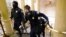 U.S. Capitol police officers take positions as protestors enter the Capitol building during a joint session of Congress to certify the 2020 election results on Capitol Hill in Washington, Jan. 6, 2021.