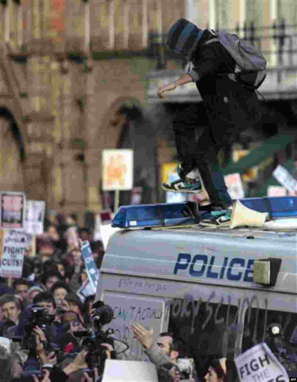 Students protest against the British government's cuts in education in central London, Wednesday, Nov. 24, 2010. Several thousand British students protested Wednesday against government plans to triple tuition fees, two weeks after a similar demonstration