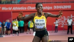 FILE - Halima Nakaayi, of Uganda, celebrates as she wins the gold medal in the women's 800 meter final at the World Athletics Championships in Doha, Qatar, Sept. 30, 2019.