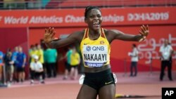 FILE - Halimah Nakaayi, of Uganda, celebrates as she wins the gold medal in the women's 800 meter final at the World Athletics Championships in Doha, Qatar, Sept. 30, 2019.