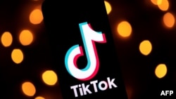 This photo taken on Nov. 21, 2019, shows the logo of the social media video sharing app Tiktok displayed on a tablet screen in Paris. 