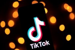 FILE - The logo of the social media video sharing app Tiktok is displayed on a tablet screen in Paris, November 21, 2019