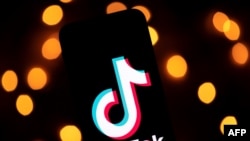 This photo taken on Nov. 21, 2019, shows the logo of the social media video sharing app Tiktok displayed on a tablet screen in Paris. 