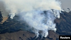 An aerial views shows a wildfire on a mountain in Ofunato, Iwate Prefecture, northeastern Japan, March 3, 2025. (Kyodo via Reuters)