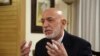 FILE - Former Afghan President Hamid Karzai speaks during an interview in Kabul, Afghanistan, Sept. 24, 2019. 