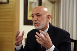 FILE - Former Afghan President Hamid Karzai speaks during an interview in Kabul, Afghanistan, Sept. 24, 2019.