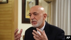 Former Afghan President Hamid Karzai speaks during an interview in Kabul, Afghanistan, Sept. 24, 2019. 