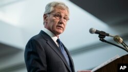 FILE - Secretary of Defense Chuck Hagel speaks at the National Security Agency, March 28, 2014, at Fort Meade, Maryland.